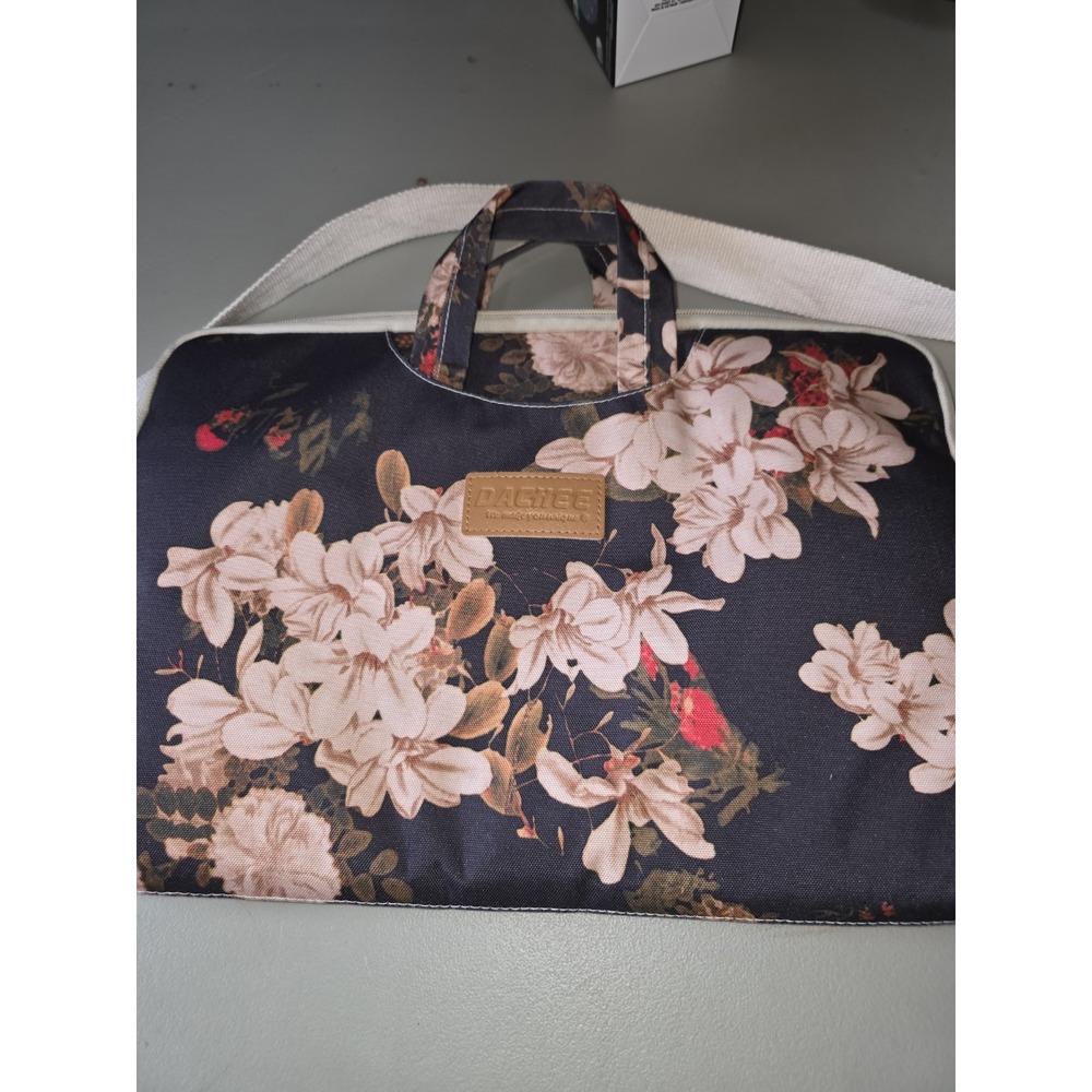 dachee laptop bag. Measures 16"by 11".β Outside Pocket Holds Your Supplies .
